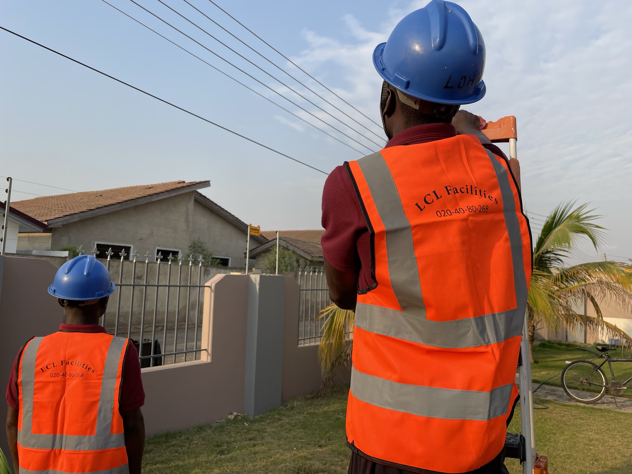 People wearing helmets with branded company apparel